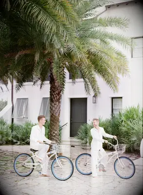 Couple riding beach cruisers in matching pajamas