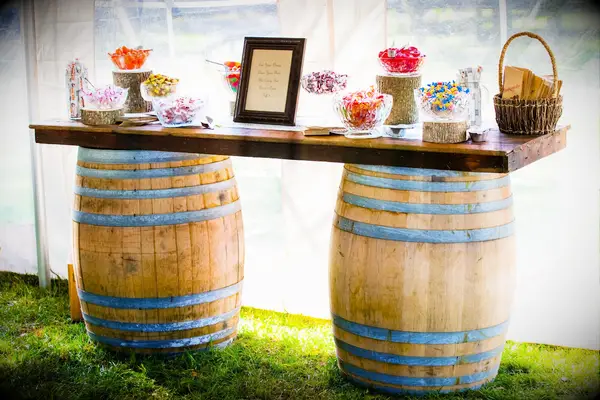 Rustic barrel candy bar at wedding reception