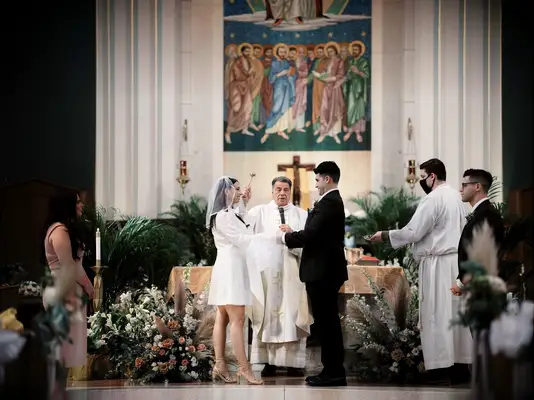 Lush Floor Flowers at Roman Catholic Wedding Ceremony