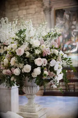 White-and-Pink Floral Arrangement in Stone Vase, Catholic Church in Italy