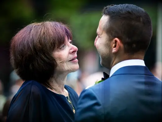groom dancing with grandmother at wedding 