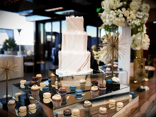 modern mirrored table with macarons for wedding dessert bar
