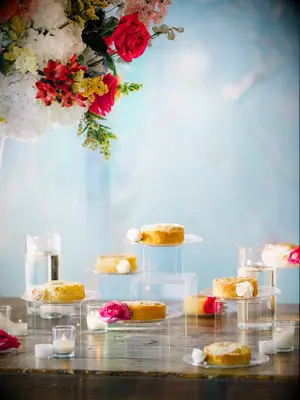 Cakes on varying levels wedding dessert display