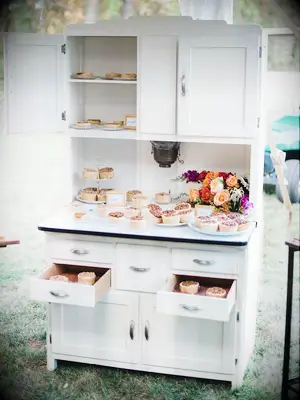 dessert buffet in vintage cabinet
