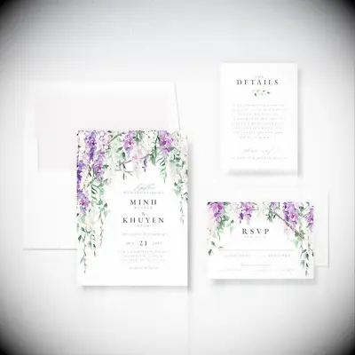 Wedding invitation suite with wisteria illustration framing the details