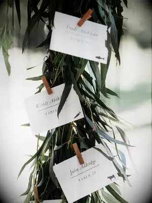 bay leaf garland with escort cards on clothespins