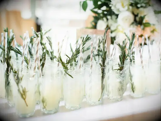 summer wedding signature cocktails rosemary-infused vodka served with striped paper straws