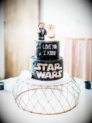 Custom black Star Wars-themed wedding cake with custom toppers