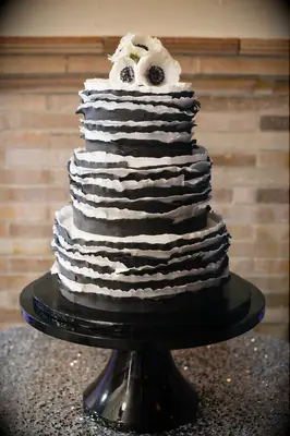 Ruffled black and white wedding cake. 