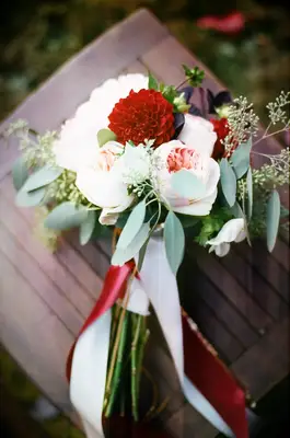 A gorgeous red and pale pink dahlia and rose bouquet.