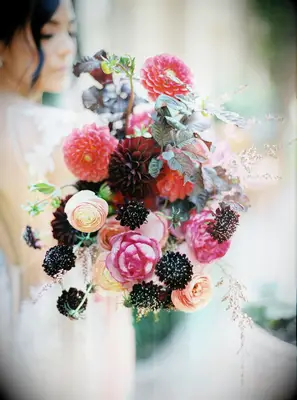Vibrant bouquet featuring black, pink, and red dahlias. 