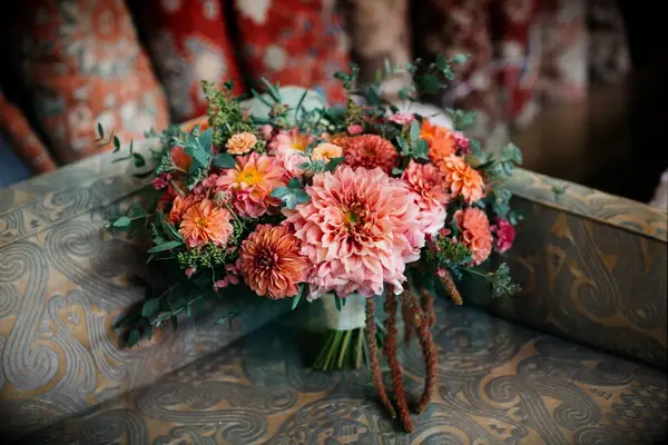 Vibrant bouquet of dahlias in pink and orange hues. 