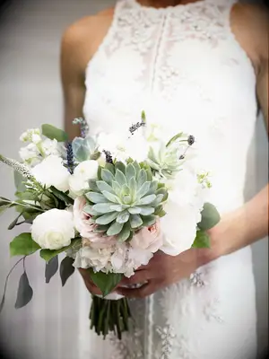 The succulent bouquet, with its delicate pastels, is sure to stun!