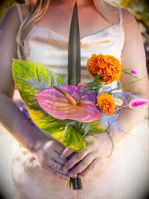 This summer wedding bouquet absolutely shines with tropical flowers in vibrant colors.