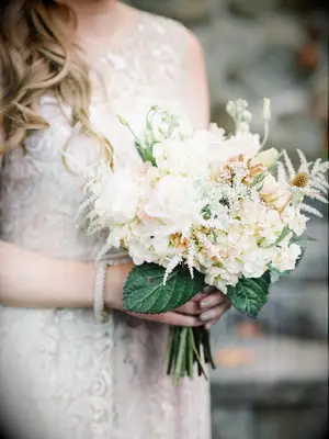 This bouquet is boho-chic, with off-white roses and sprays of wild flowers.