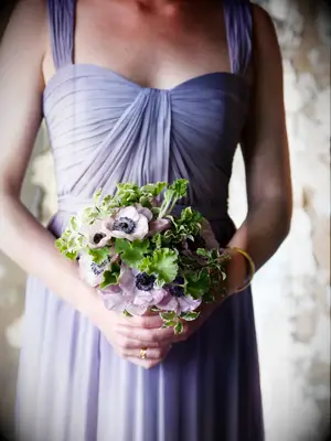 This purple wedding bouquet is elegant, delicate, and ready for your special day.