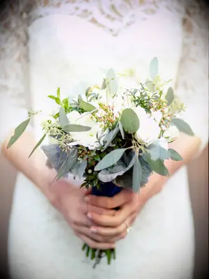 The greenery in this wedding bouquet takes center stage.