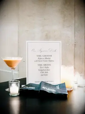 signature wedding drink signage with espresso martini and vodka spritzer