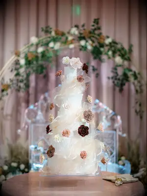 luxury seven tier wedding cake decorated with sugar flowers and clear sugar ribbons inspired by icicles