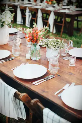 inexpensive wedding table decor with wildflower centerpieces in mason jars