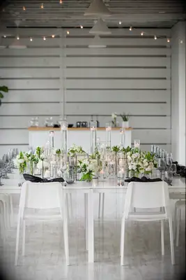 modern minimalist wedding tablescape with floating candles and greenery