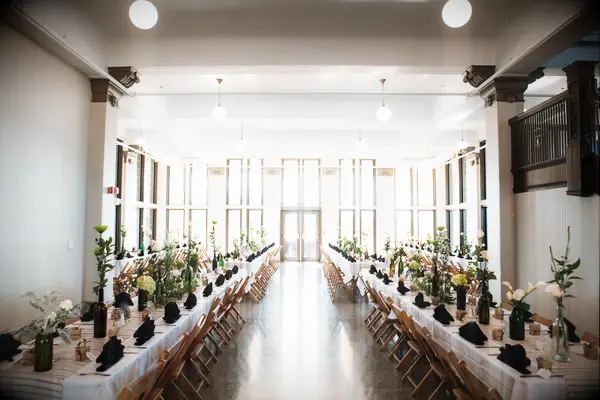 wedding reception space with long banquet tables