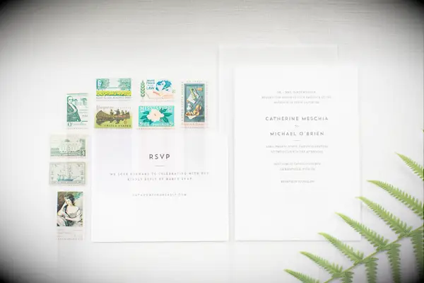 inexpensive wedding invitation idea with colorful vintage stamps
