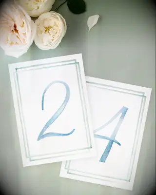 watercolor table number cards with blue numbers and double line light green border