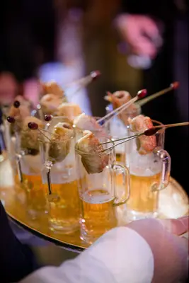 Pigs in a blanket with tiny beer steins for your wedding reception