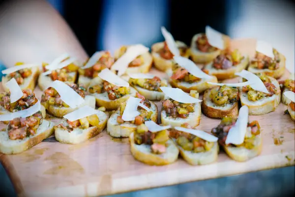 A tray of tomato and cheese bruschetta for your wedding cocktail hour