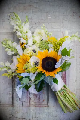 fall wedding bouquet with sunflowers, white anemones and stock