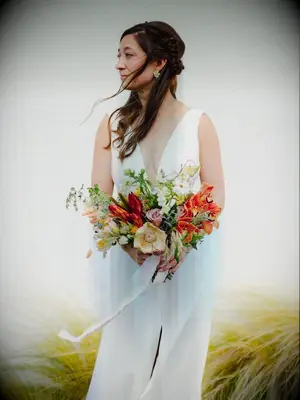 Bride holding red bouquet