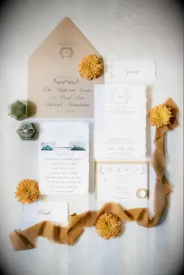 A breathtaking autumn-inspired stationery suite in muted gold and orange tones.