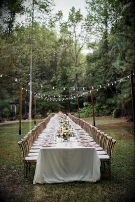 The tables are set at this beautiful cream-toned wedding reception.