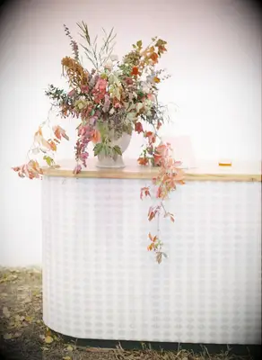 A beautiful autumnal flower arrangement of multicolored fall leaves.