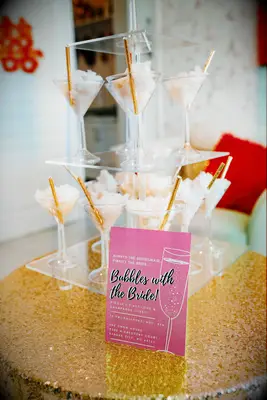 tower of martini glasses with cotton candy and gold straws