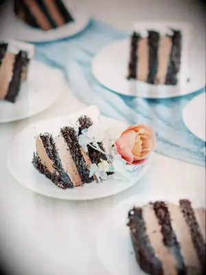 slices of layered chocolate wedding cake on plates