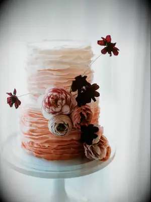 ombre wedding cake with pink ruffled buttercream