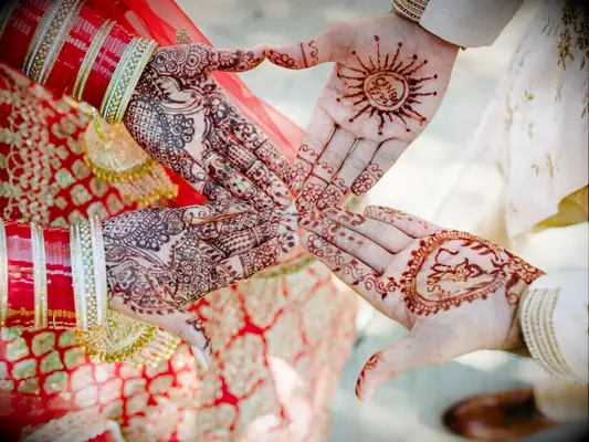 Matching bride and groom henna tattoos by EM Event Photography