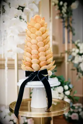 Madeline tower displayed on a dessert table. 