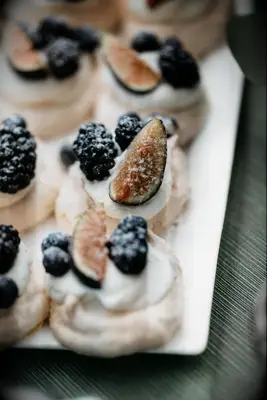 Mini pavlovas with cream and berries. 