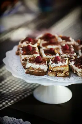 Tray featuring slices of tiramisu. 