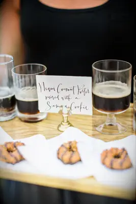 A tray of cookies and small glasses of porter to pair. 