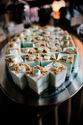 Mini key lime pie shooters on a serving tray. 