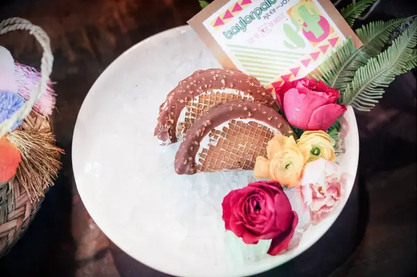 Chocolate ice cream tacos displayed on ice. 