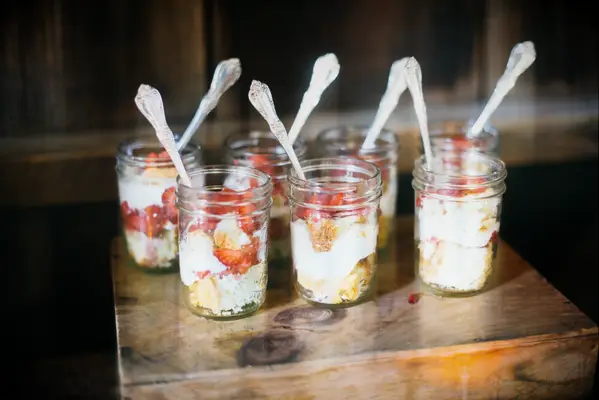 Delicious strawberry shortcakes presented in mason jars. 