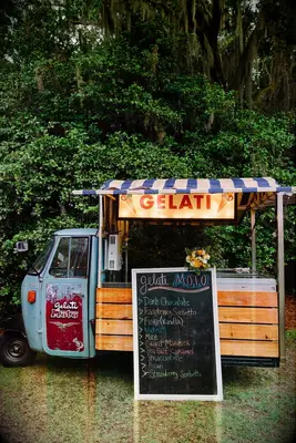 Retro gelato truck at an outdoor wedding reception. 