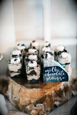 Miniature glasses of milk chocolate mousse. 