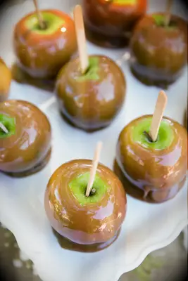 Caramel covered apples on a tray. 