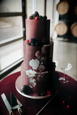 Three-tiered Red Wedding Cake Topped With Berries